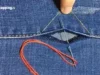 Tozapping.tv cómo coser manualmente las costuras laterales de un pantalón vaquero descosido utilizando el hilo original
